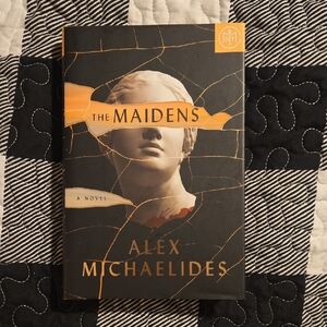 The Maidens Hardcover Book